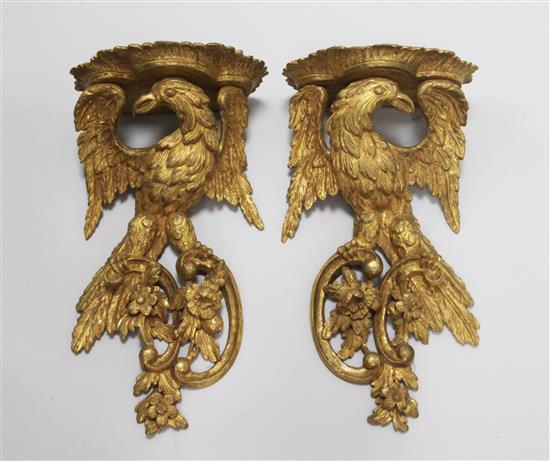 A pair of Chippendale style giltwood eagle wall brackets W.8.5in. H.17in.